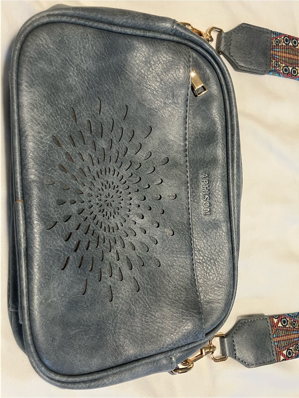 Blue Aphison Faux Leather Crossbody with Laser-Cut Floral Detail